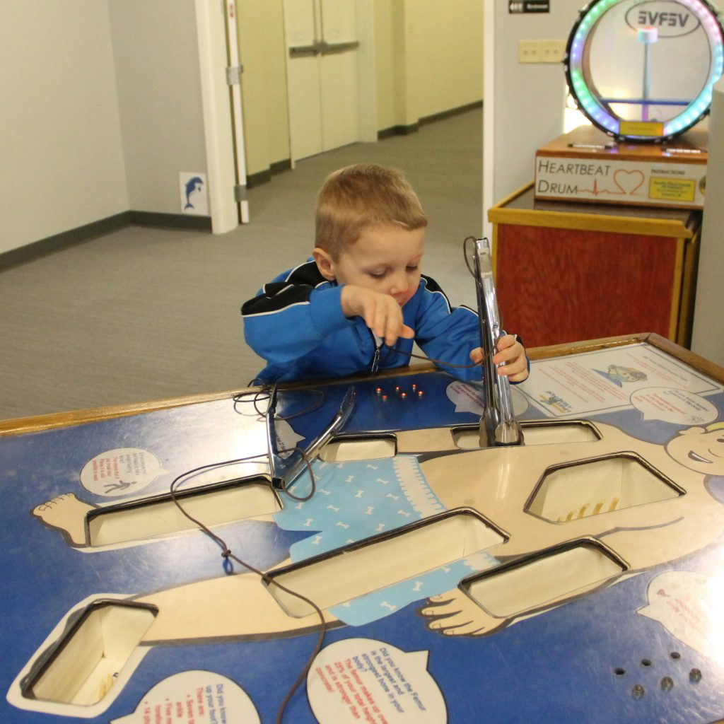 Tyler playing operation at a science center in PA