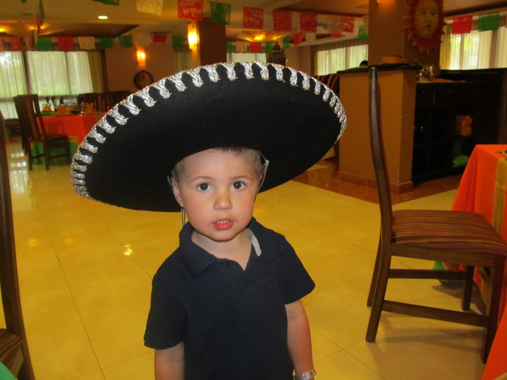 Boy wearing sombrero at Sandos Resorts