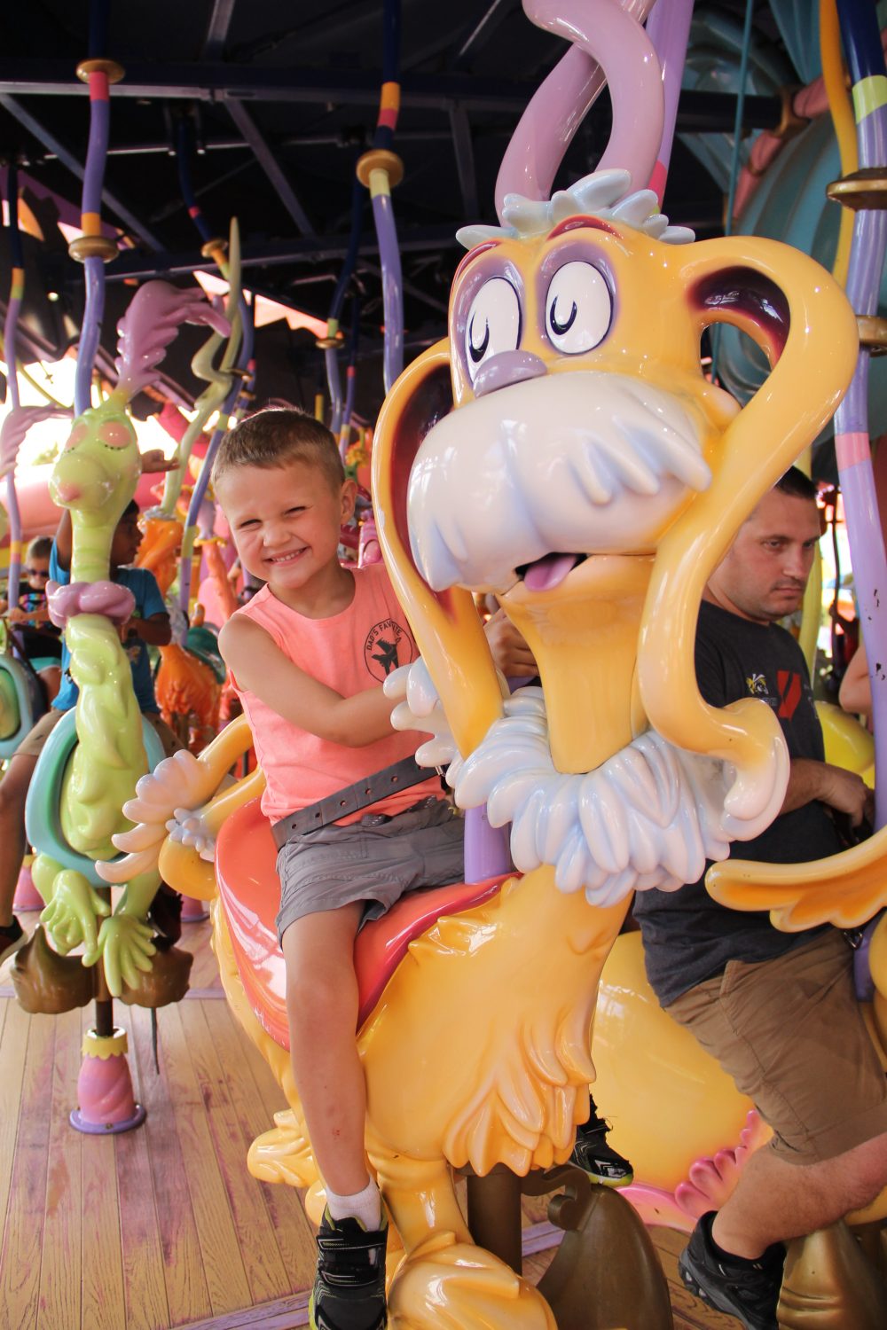 Child riding the Caro-Seuss-el at Universal's Islands of Adventure