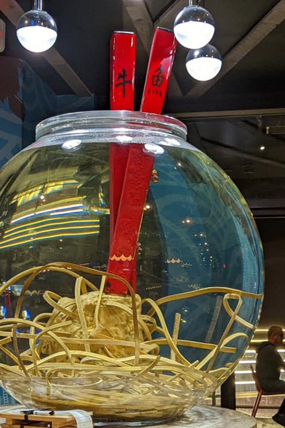 Decor at Cowfish.  Large fish bowl with chopsticks and noodles