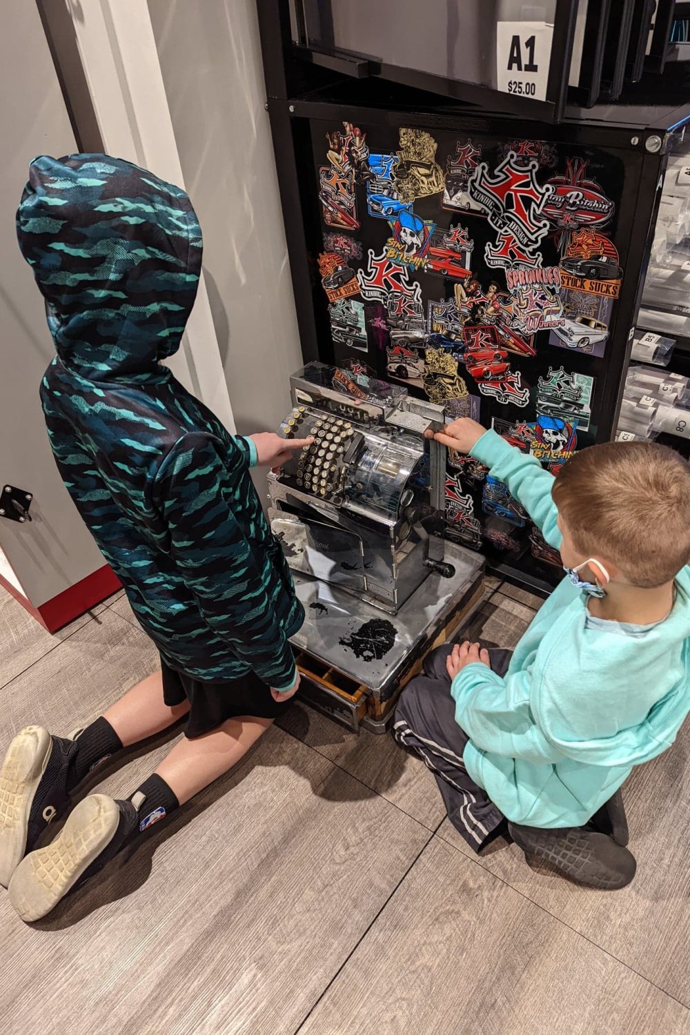 Kids enjoying the old cash register