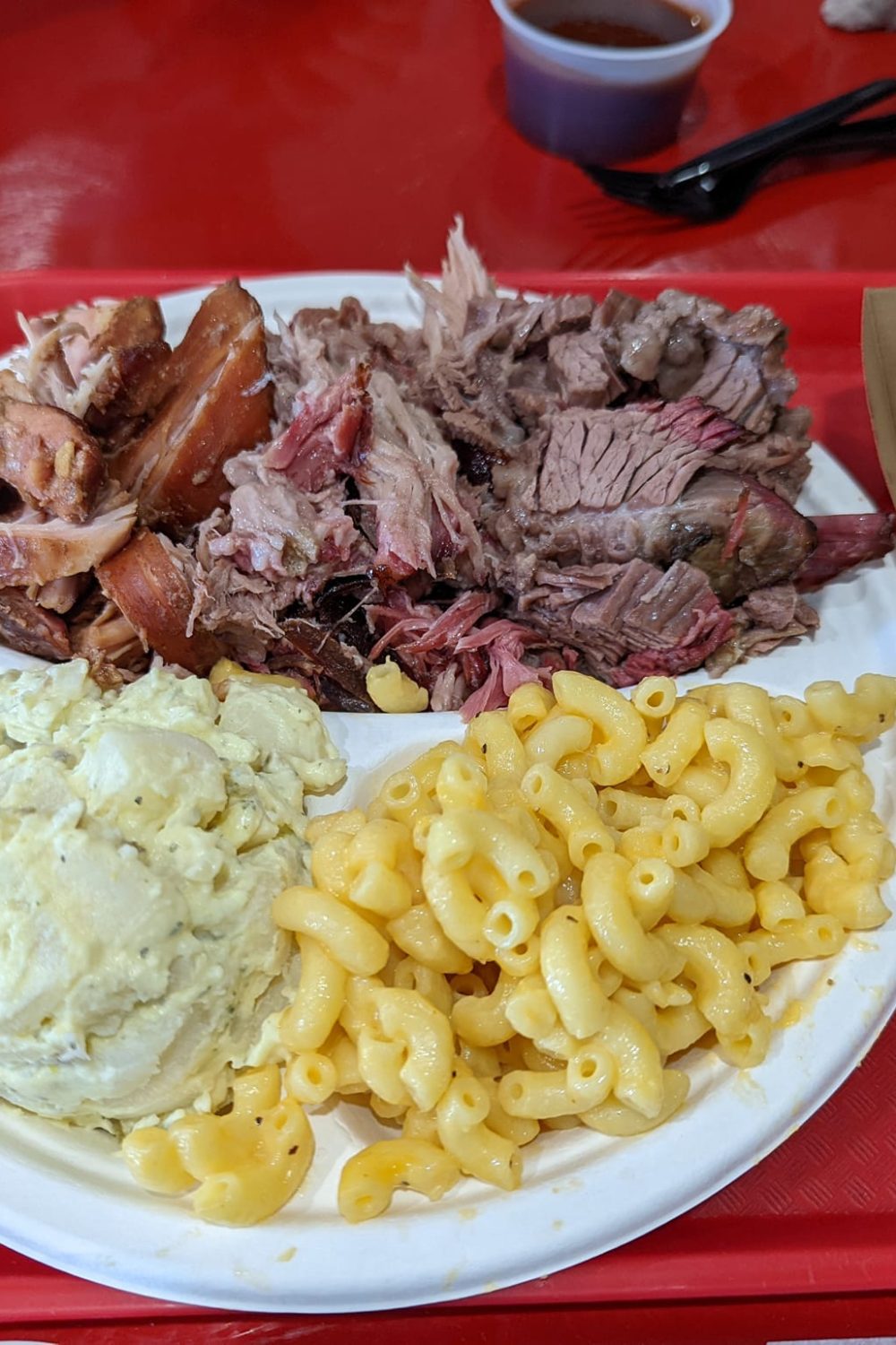 Three Meat platter with brisket, pulled pork and chicken along with potato salad and mac and cheese from IDK BBQ in Tropic, Utah.