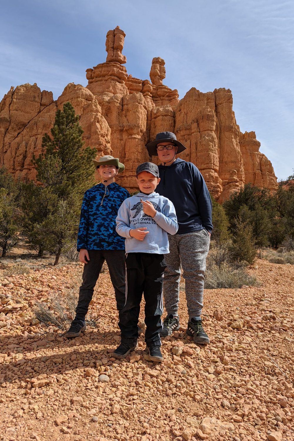 Boys standing in front of the hoodoos near the Red Canyon Visitor Center