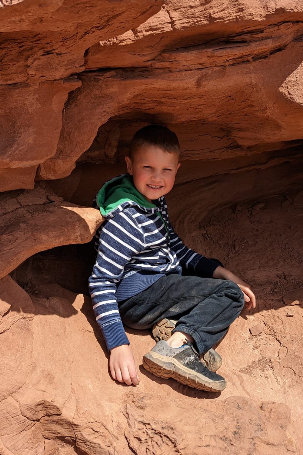 Tyler playing in one of the many "cubbies" on the Hickman Bridge Trail in Capitol Reef National Park.