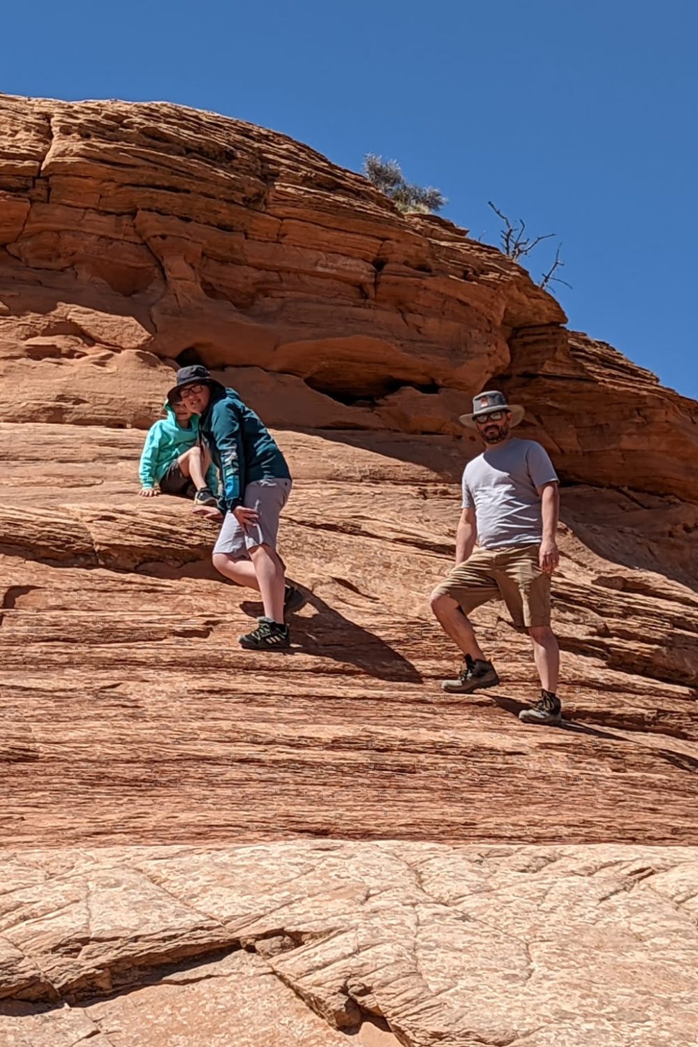 Kids climbing on the Mesa Arch Hike