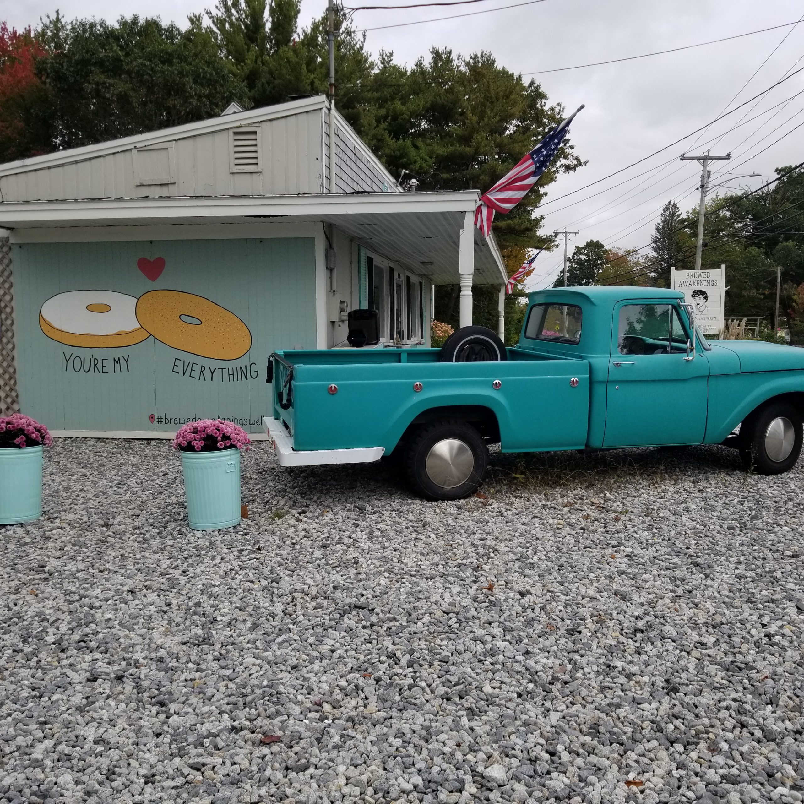 Brewed Awakenings is a coffee shop on the way to Kennebunkport, ME with a cute little photo opportunity with a teal truck and cute mural.