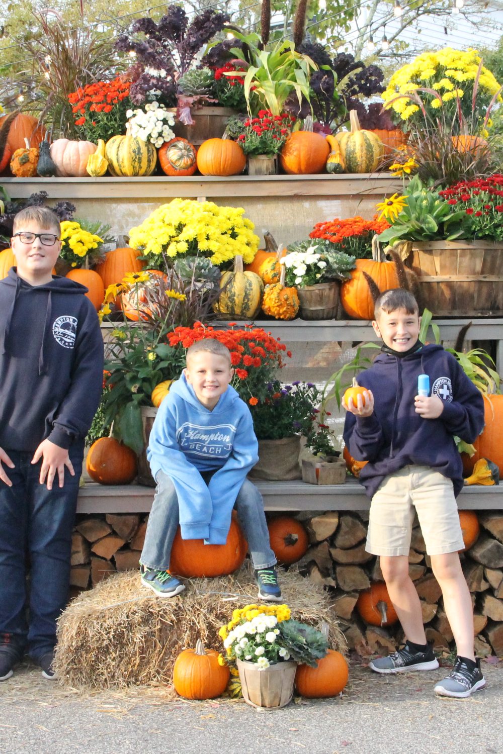 We couldn't resist a fall photo with our boys.  The backdrop is all the fall colors with mums, pumpkins, gourds, etc.
