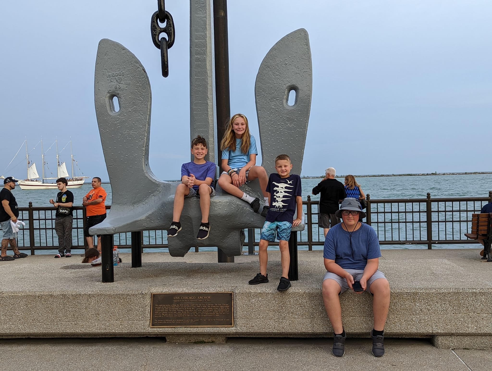 Kids sitting on the anchor at the Navy Pier in Chicago