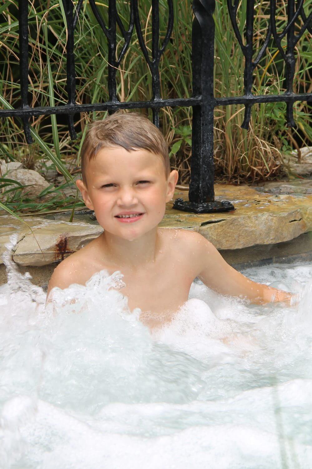 Kid enjoying the hot tub at Big Cedar Lodge