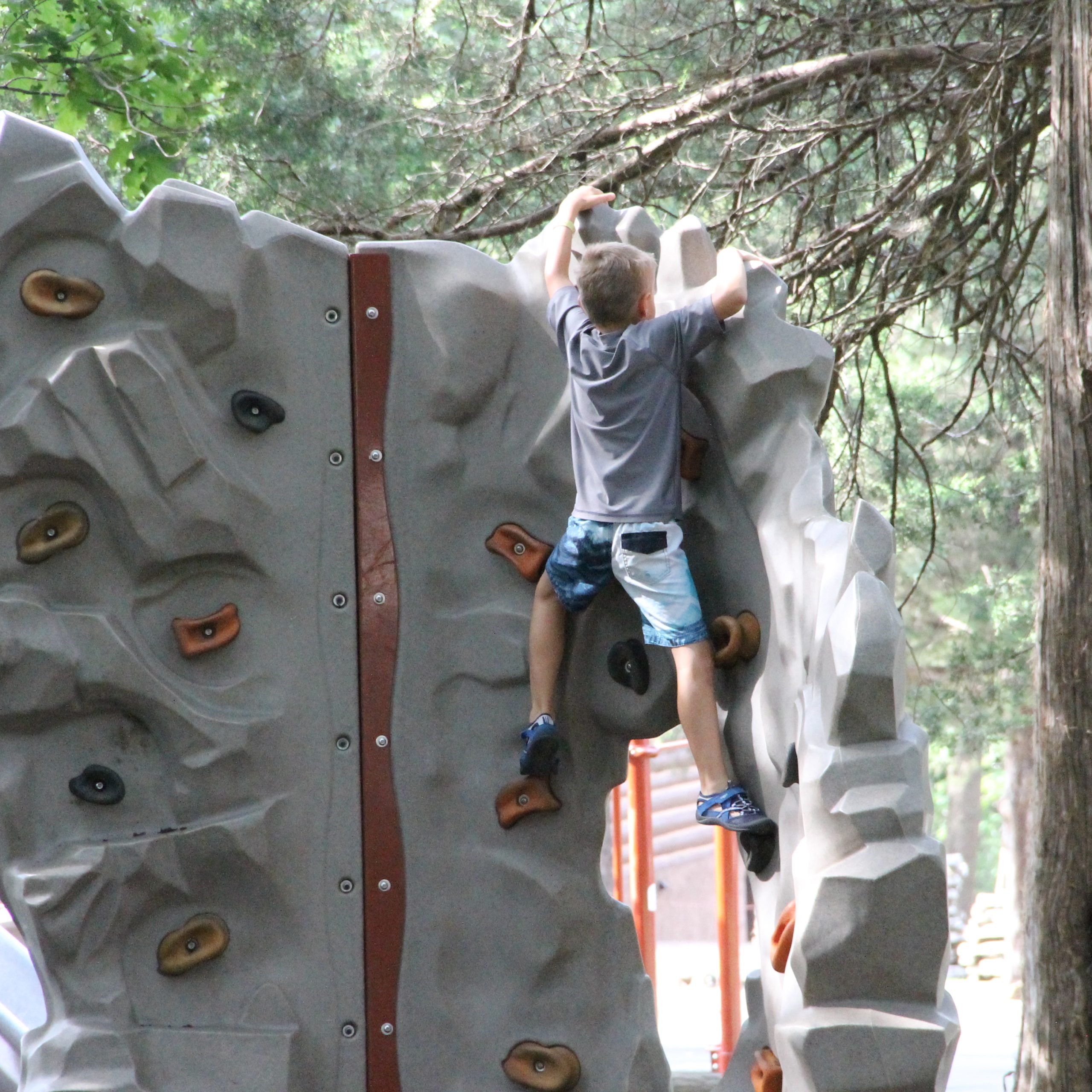 Climbing the rock wall at Big Cedar Lodge