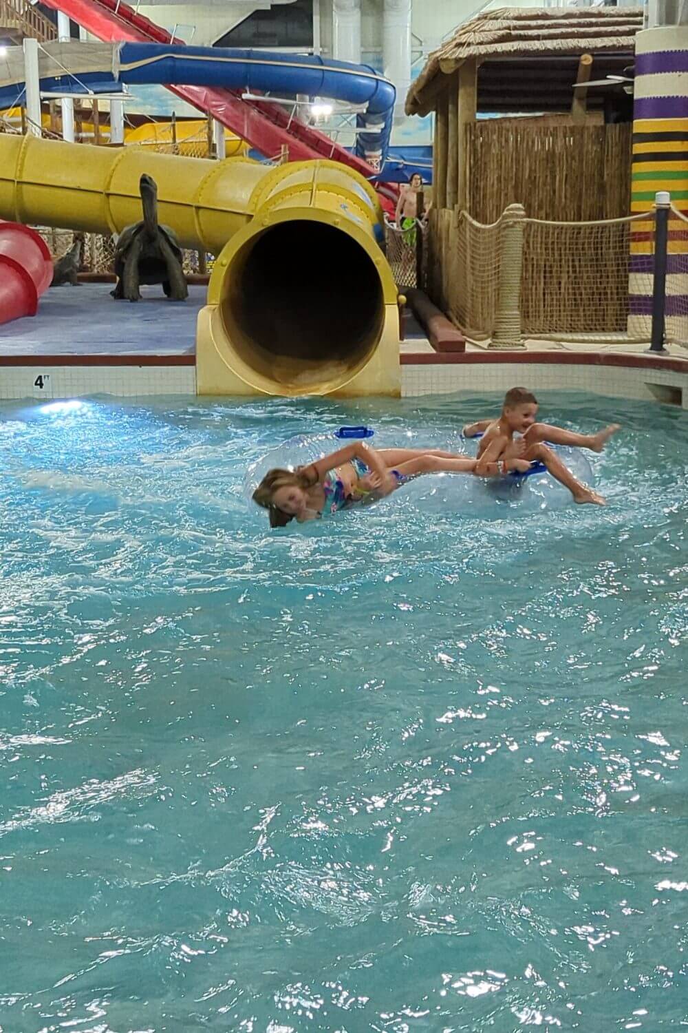 Our kids coming out of the tube slide at Kalahari