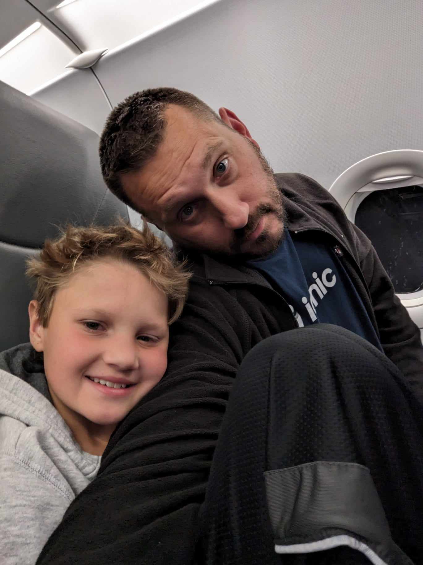 Dad and son on a cheap Frontier Flight