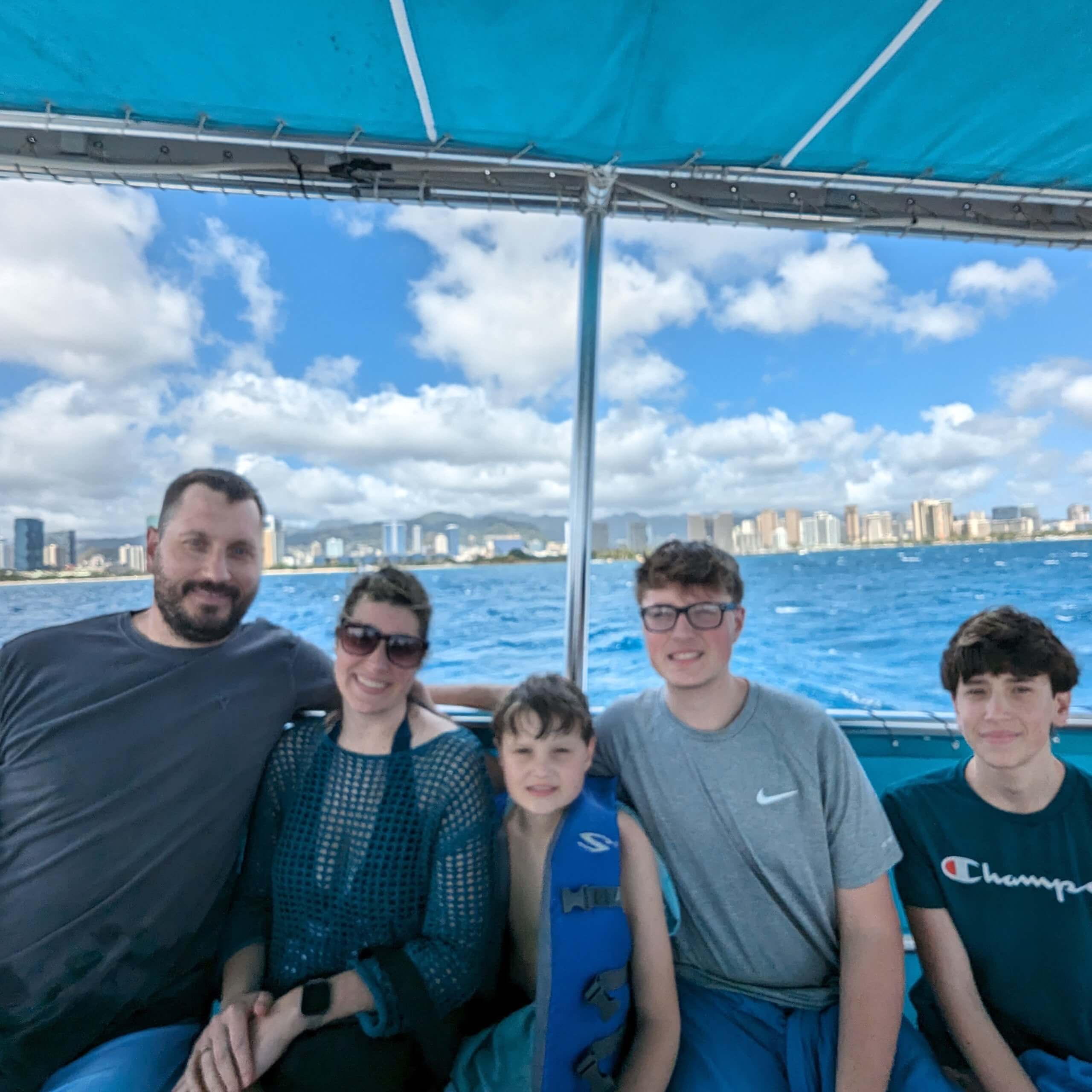 Family photo on the boat when we snorkeled with the Honolulu Snorkel Co. on Oahu