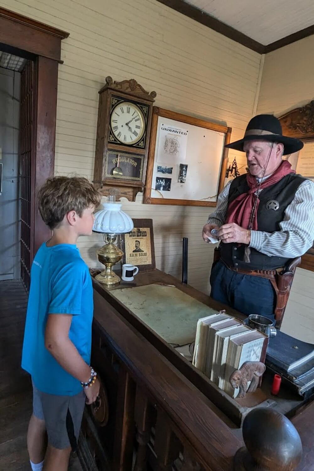 Tyler getting his sheriff badge at the 1880 town