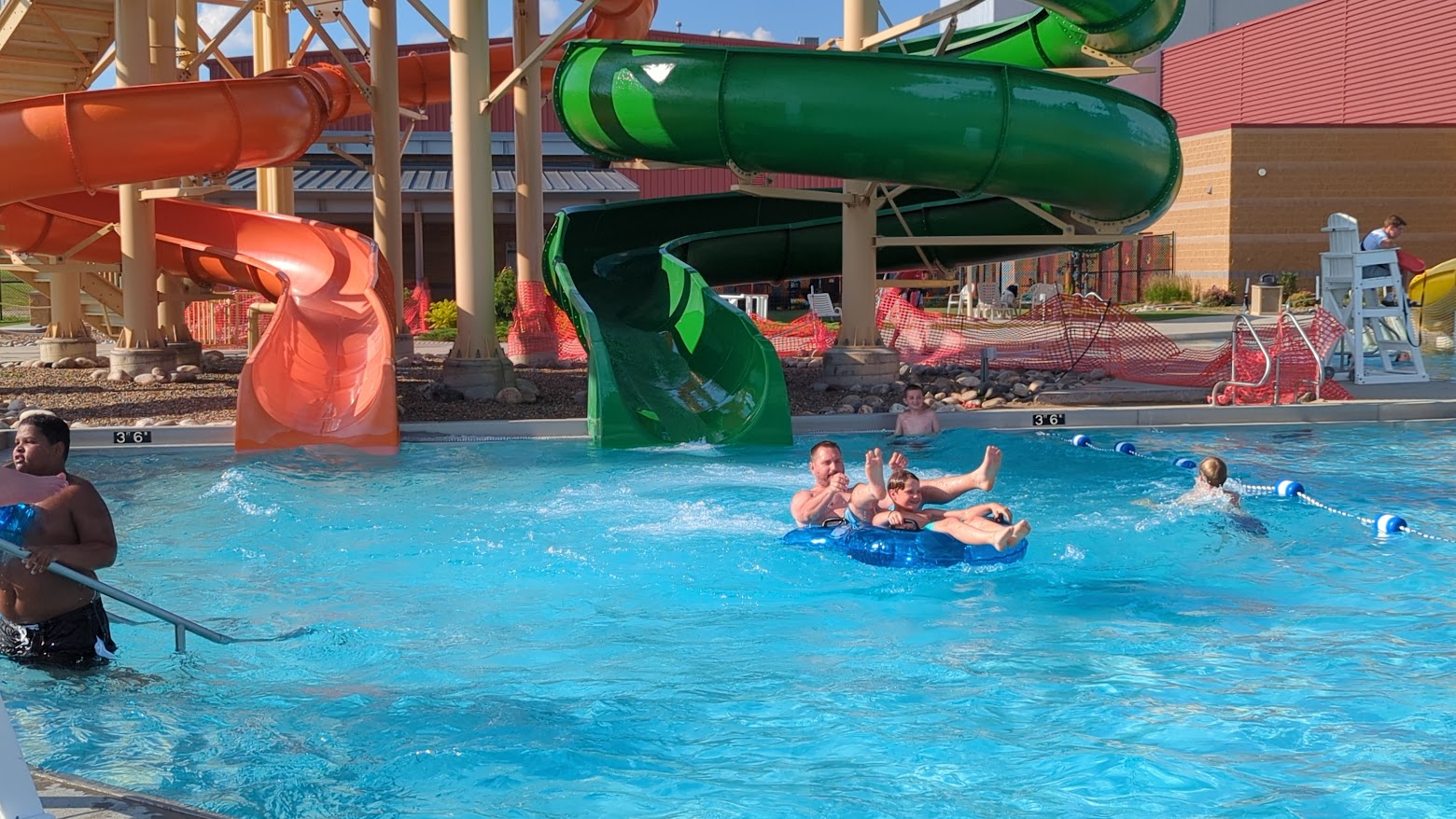 Enjoying the water slides at the West River Community Center