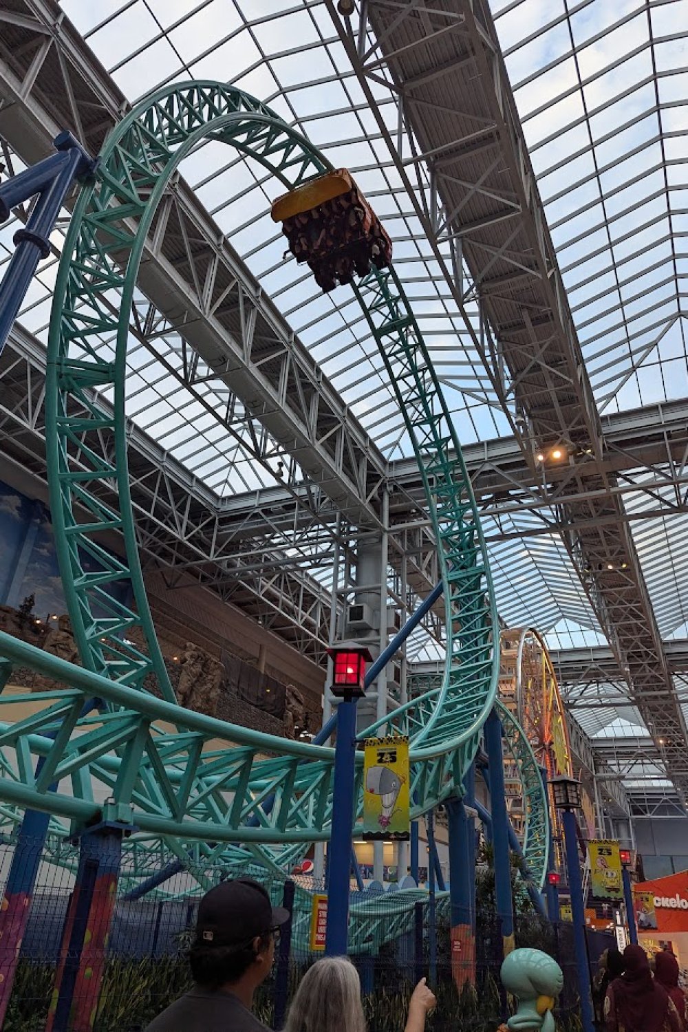 Kids riding a roller coaster at the Mall of America