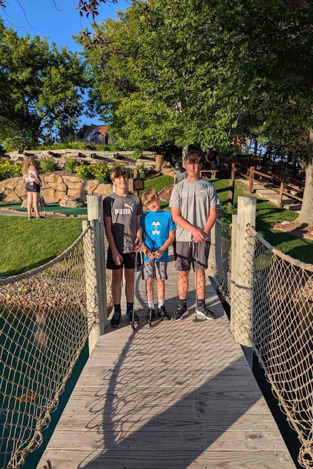 The boys ready for a round of putt-putt at Priate's Cove Adventure Golf