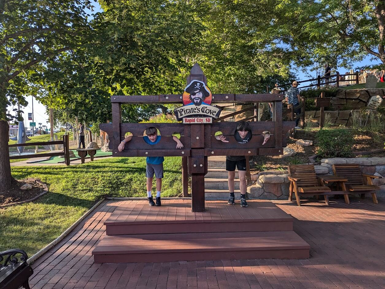 The boys posing at Pirate's Cove Adventure Golf