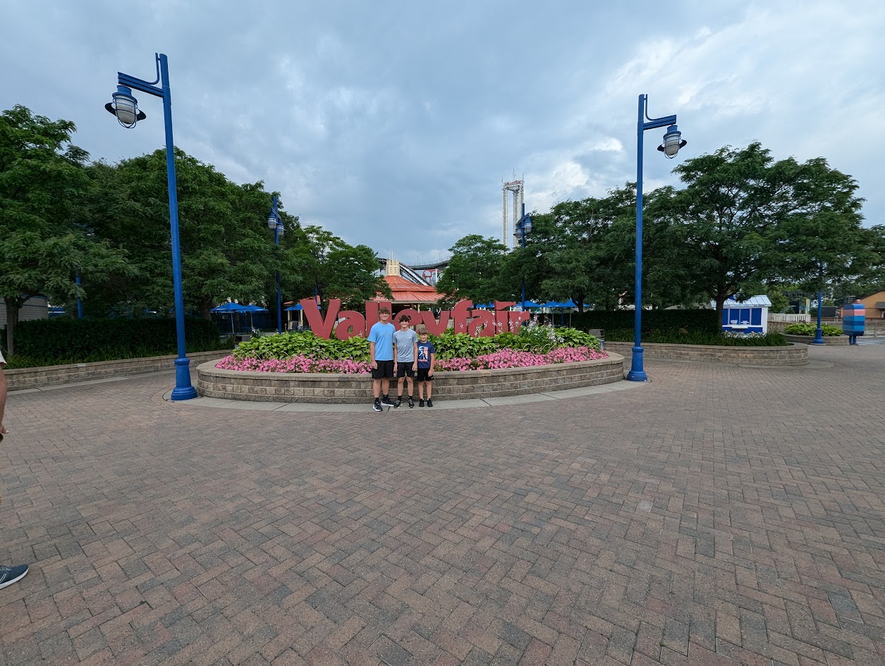 Kinds in front of the Valley Fair sign