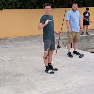 Cohen posing with the fish he caught