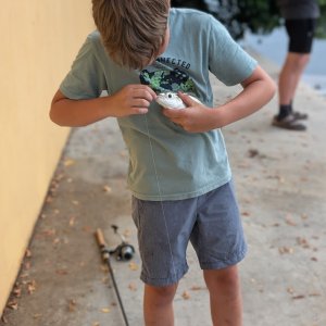 Tyler removing the hook from the fish he caught