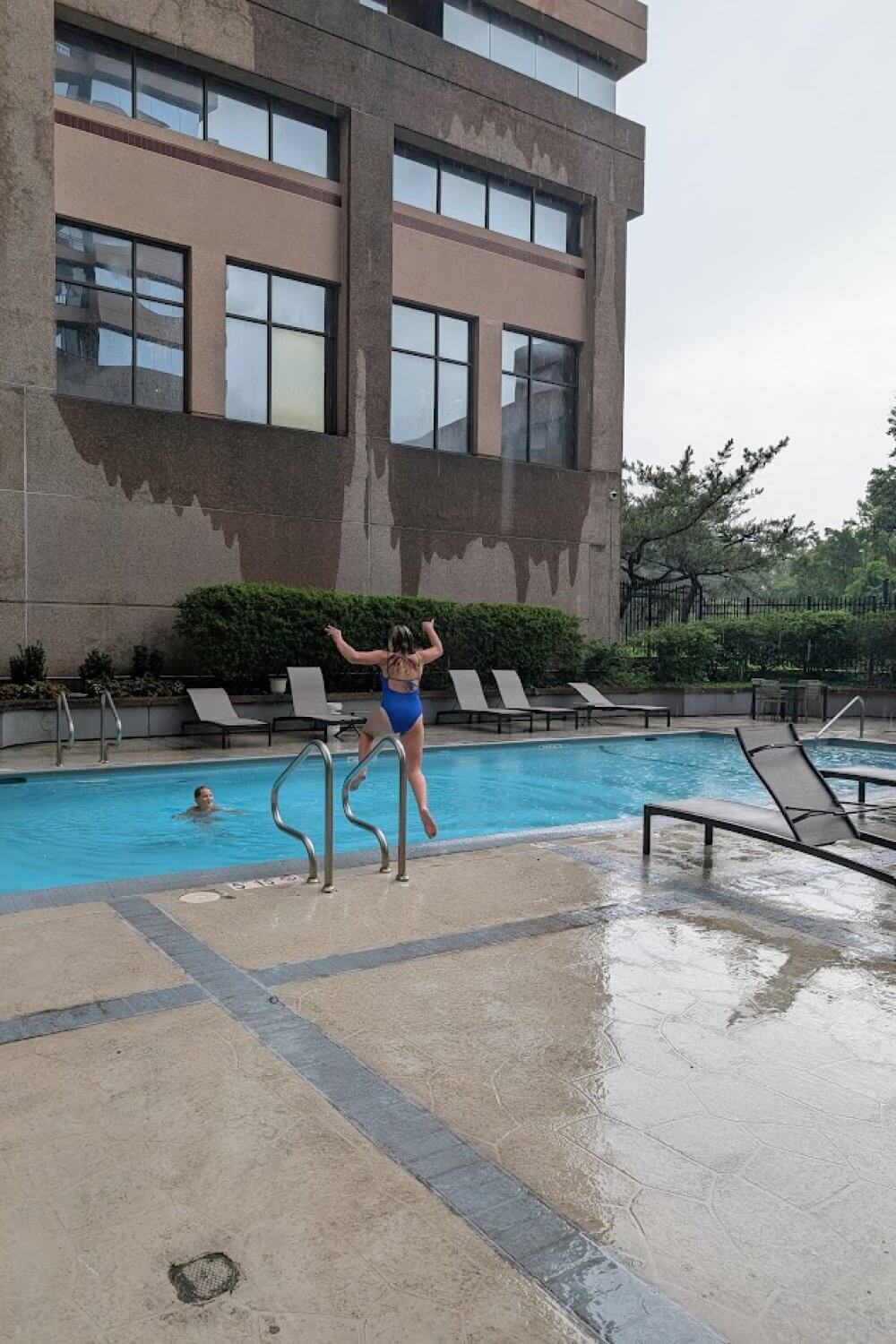 Kids jumping into pool at Embassy Suites in Bethesda, MD