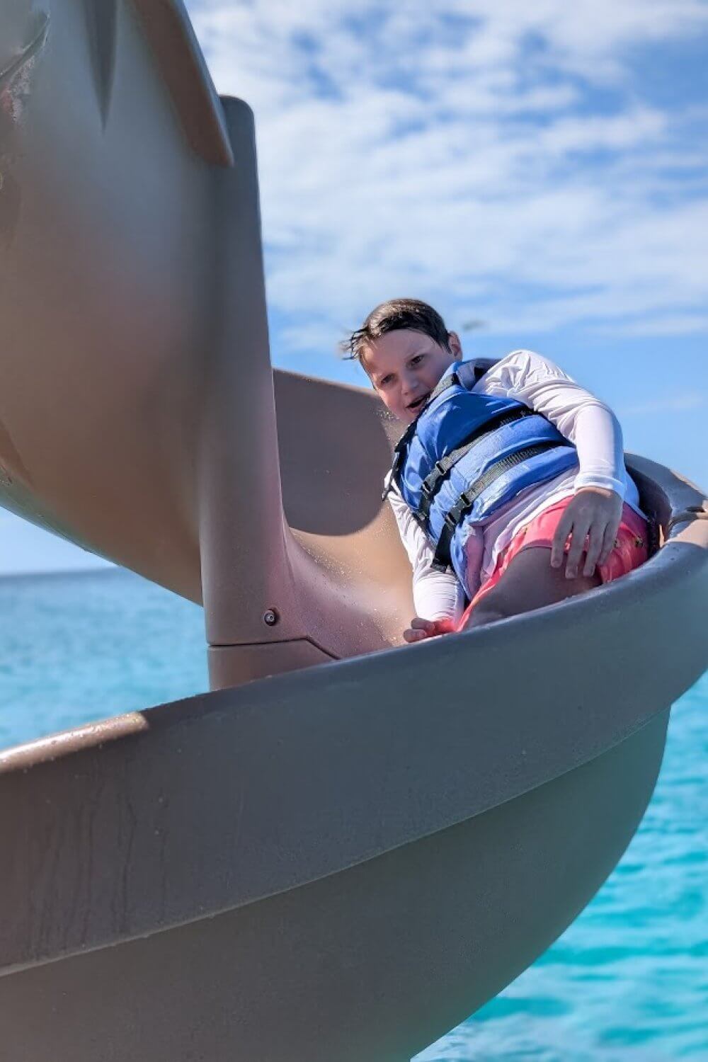 Tyler sliding down the waterslide on our catamaran