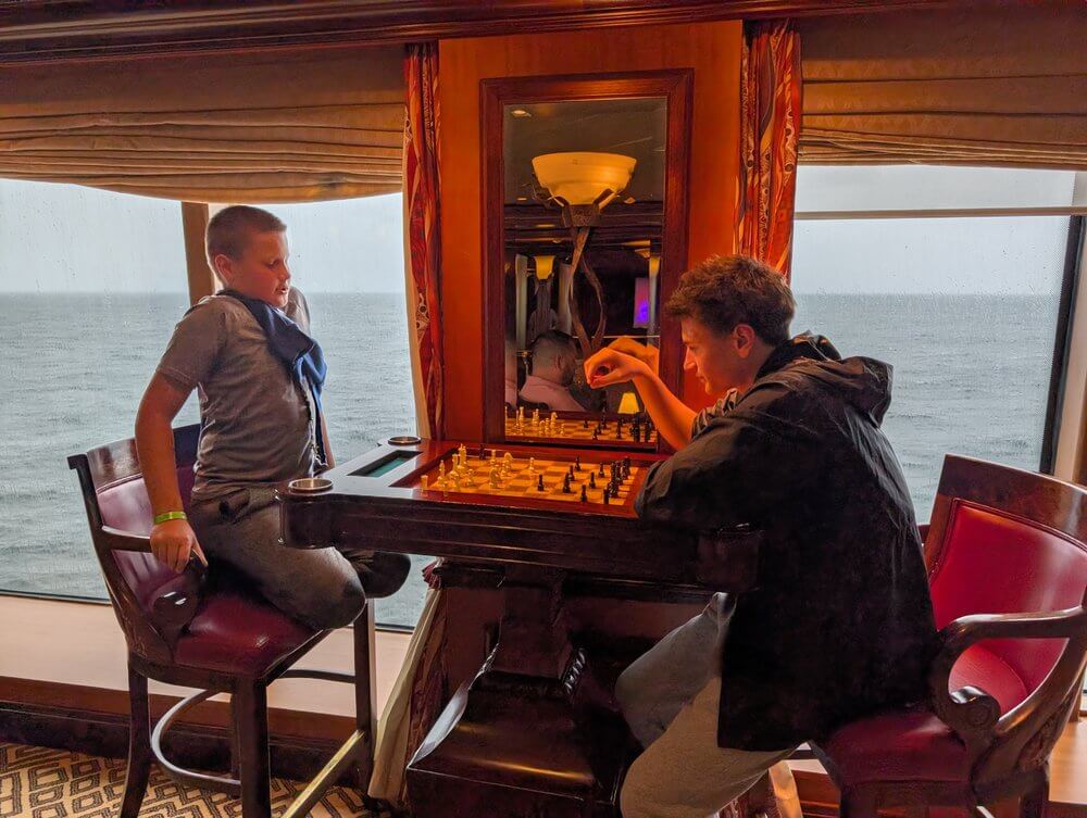 Boys playing chess on the cruise ship