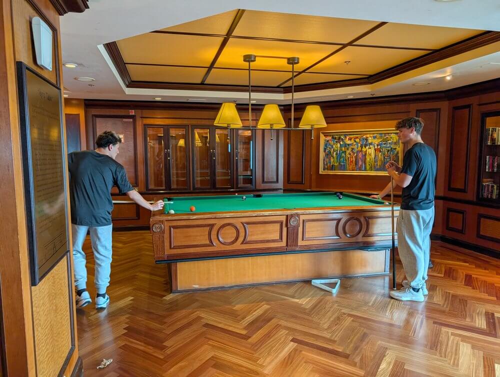 Boys playing pool on the cruise ship