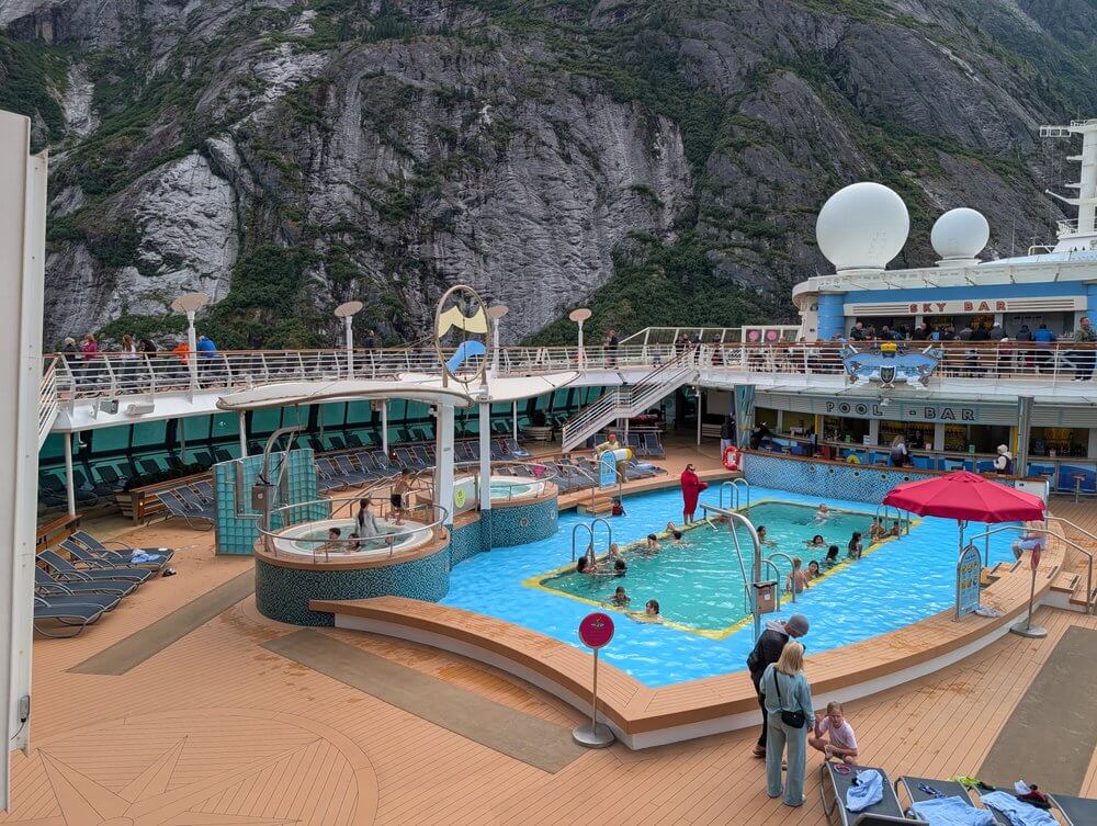 Serenade of the Seas pool deck with Glaciers in the background