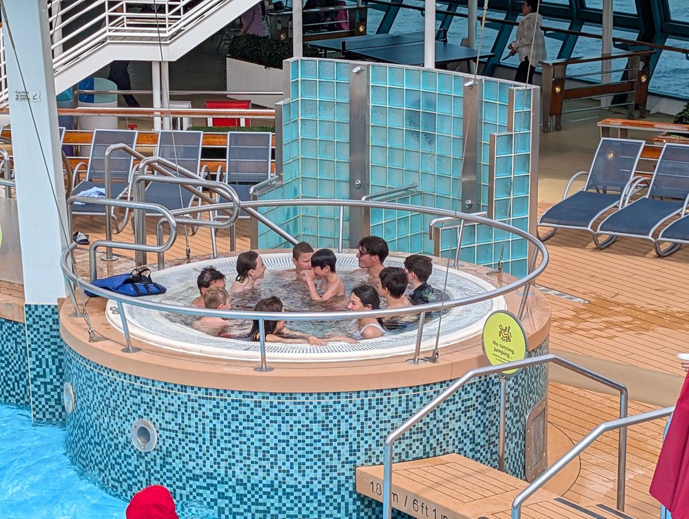 Boys in the hot tub with new friends on the cruise ship